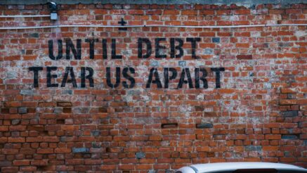 until debt tear us apart brick wall vandal